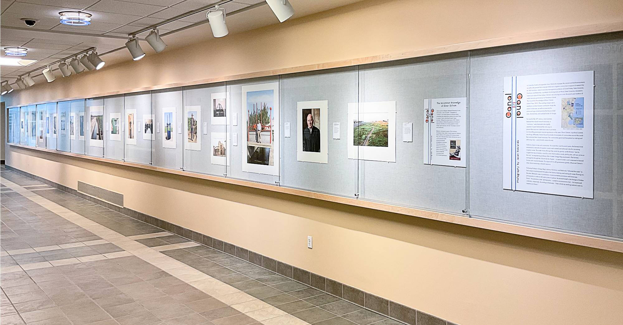 View of the wall exhibition, Canal by Canal, installed at the Lake Ontario Hall Wall Gallery.